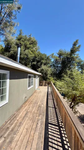 a view of house with trees in the background