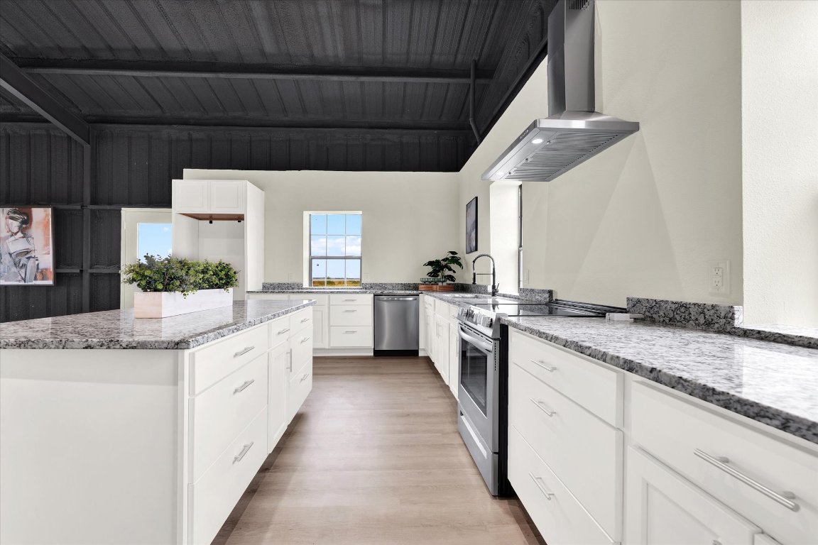 261 County Road 423 Taylor, TX 76574 - Photo 16 of 33 a kitchen with granite countertop cabinets stainless steel appliances a sink and a counter top space