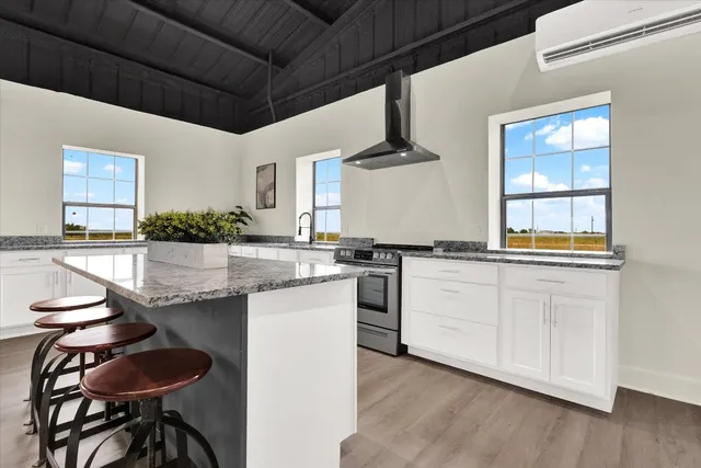 a bed room with a bed and a chair