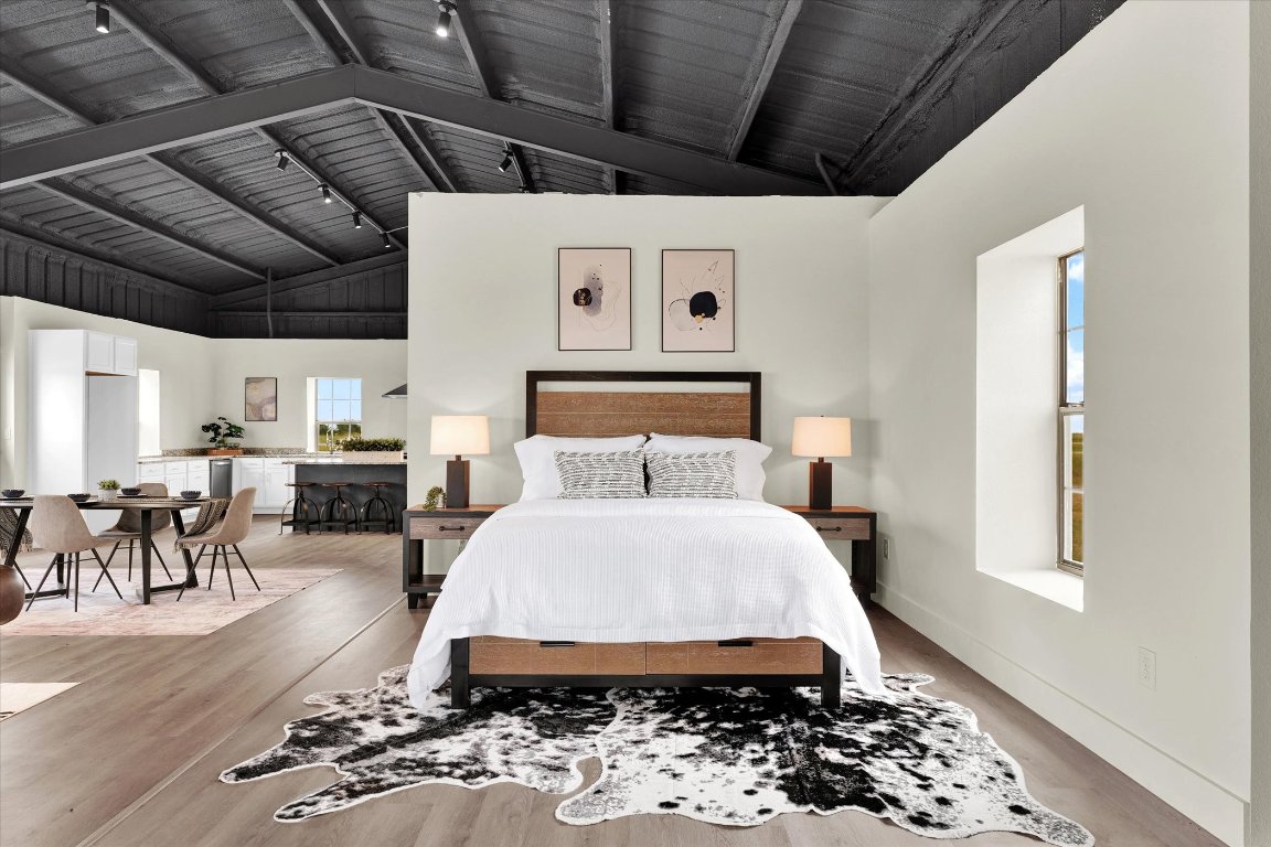 261 County Road 423 Taylor, TX 76574 - Photo 19 of 33 a bed room with a bed and a chair