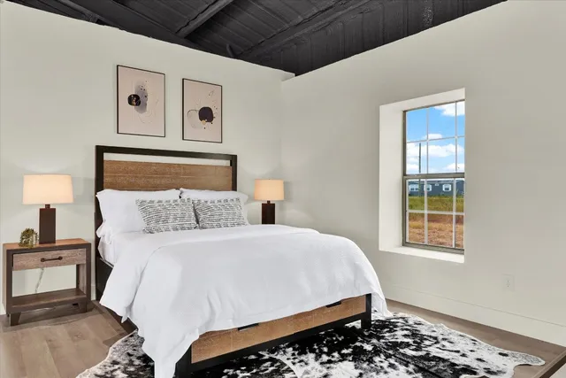 a bathroom with double sink and a mirror