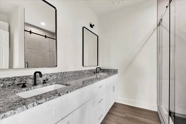 a view of a bathroom with a sink and mirror