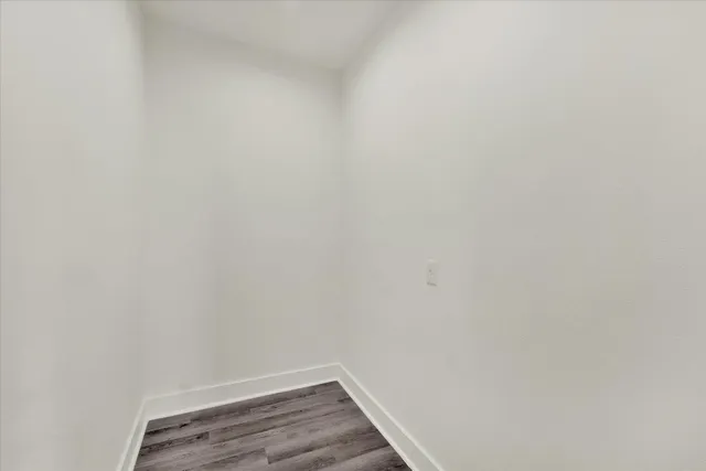 a living room with furniture a rug and a window