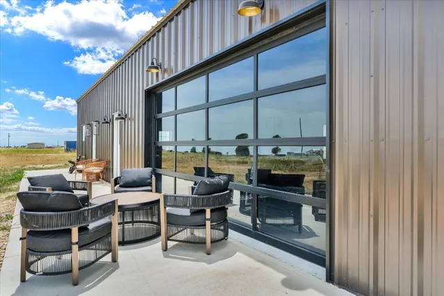 a view of a house with a dry yard and covered with fog