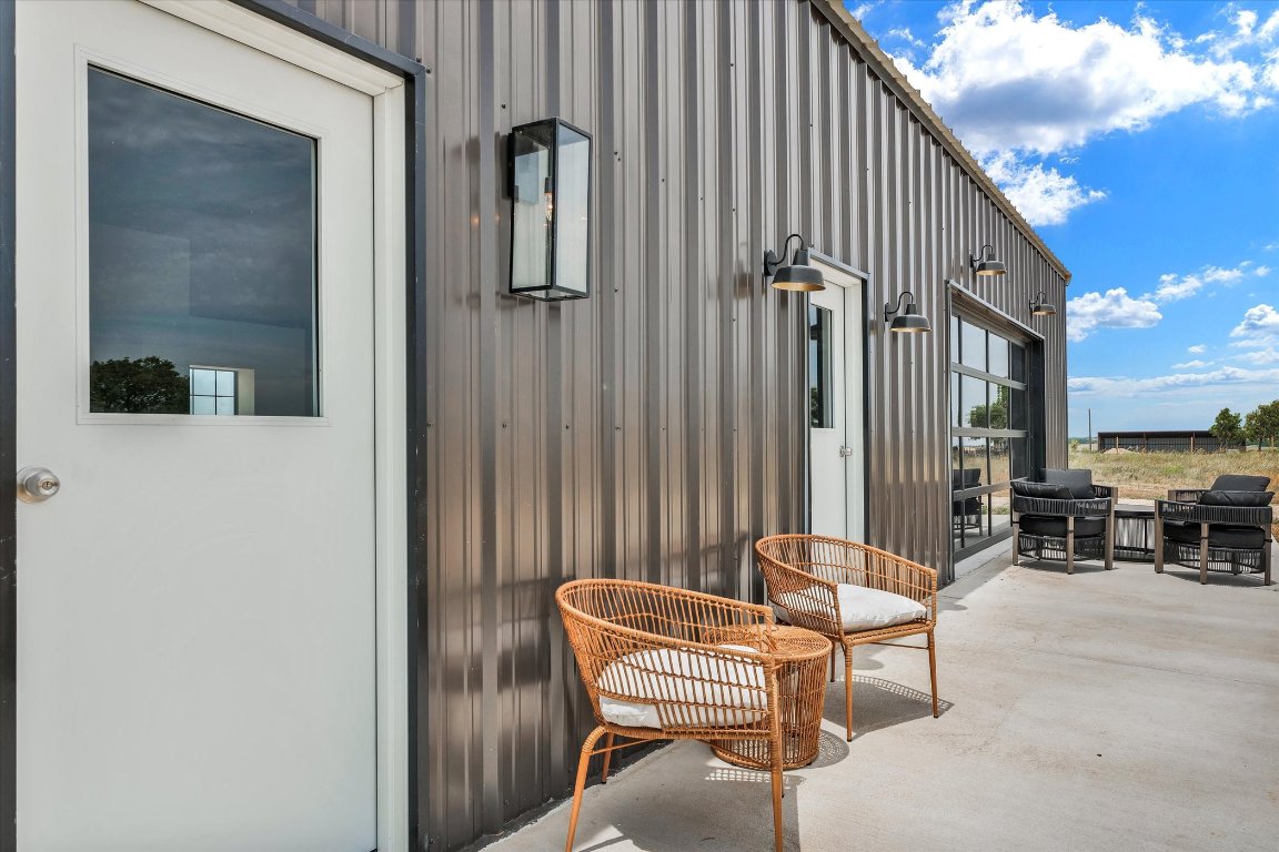 261 County Road 423 Taylor, TX 76574 - Photo 7 of 33 a balcony with table and chairs