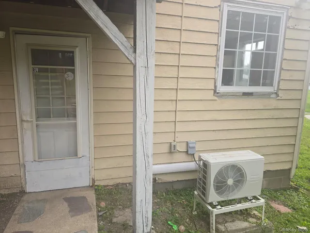 a bathroom with a toilet and shower