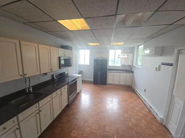 a large kitchen with cabinets