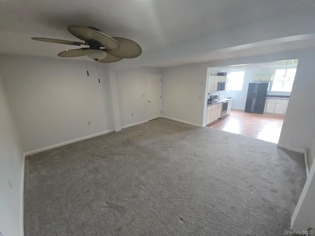 an empty room with a empty space and windows