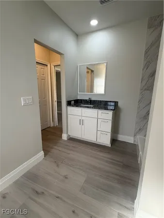 a kitchen with a sink and a stove top oven