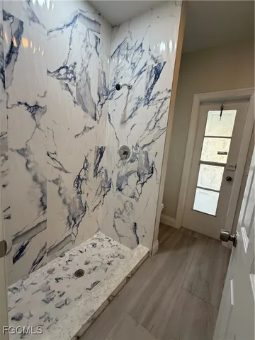 a view of a balcony with wooden floor