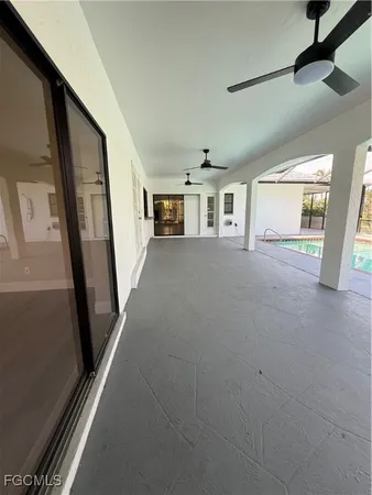 a view of a hallway with windows