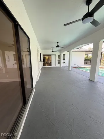 a view of a hallway with windows