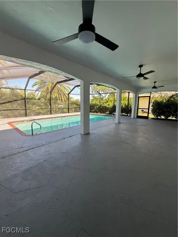 a view of an empty room with windows