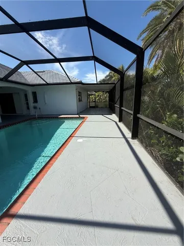 a view of swimming pool with a yard