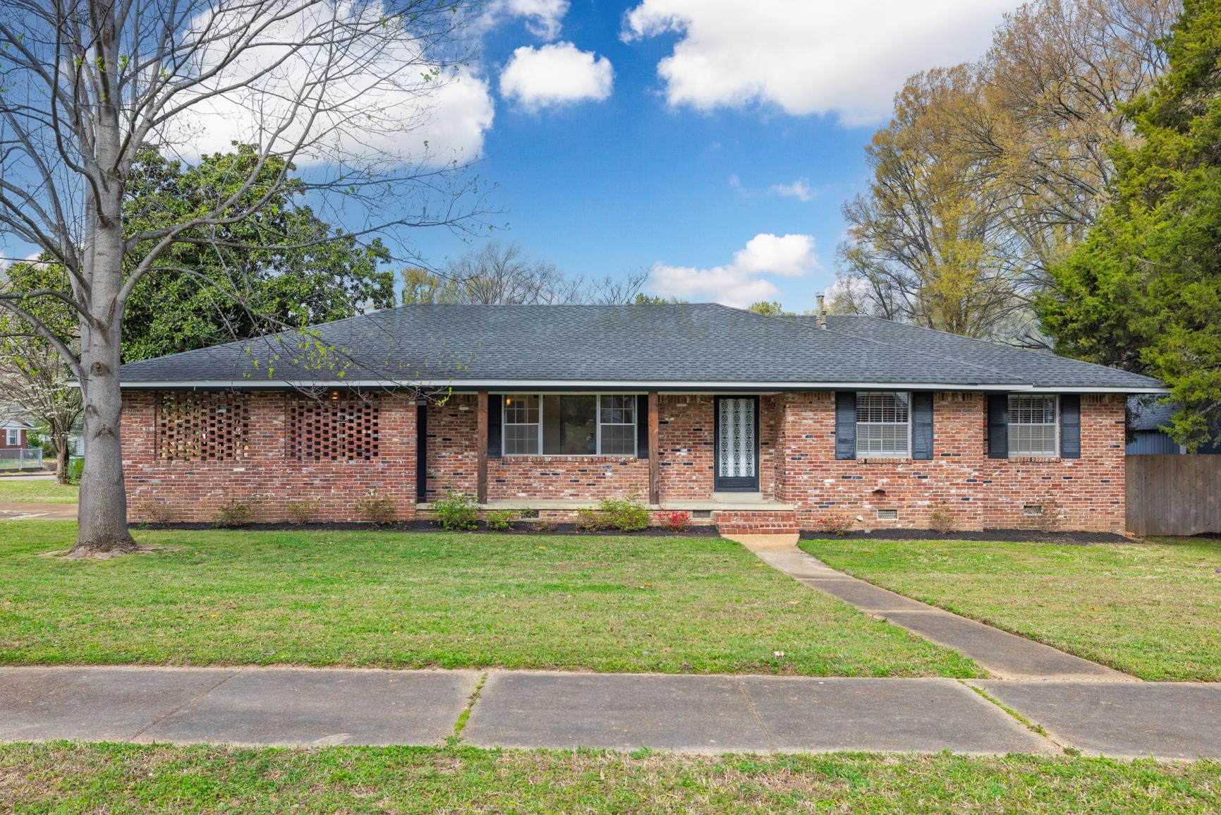 7223 Renda Street Millington, TN 38053 - Photo 1 of 24 a front view of a house with a yard and garage