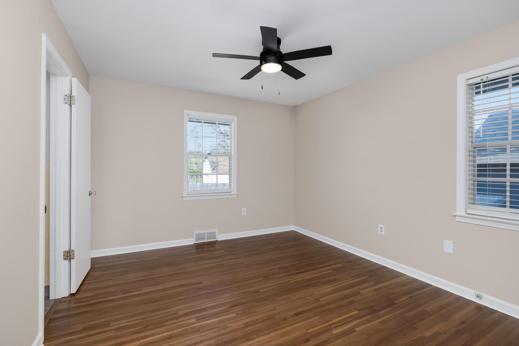 7223 Renda Street Millington, TN 38053 - Photo 13 of 24 wooden floor in an empty room with a window