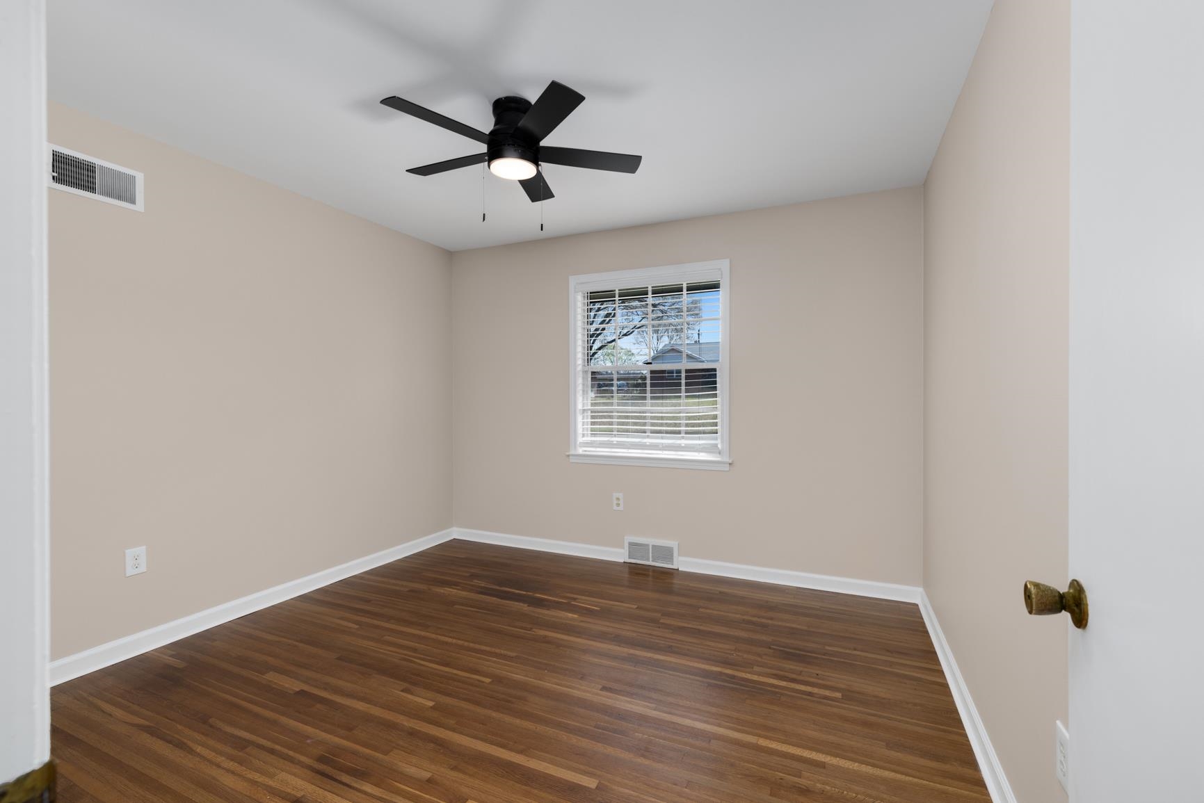 7223 Renda Street Millington, TN 38053 - Photo 16 of 24 a view of a big room with wooden floor closet and windows