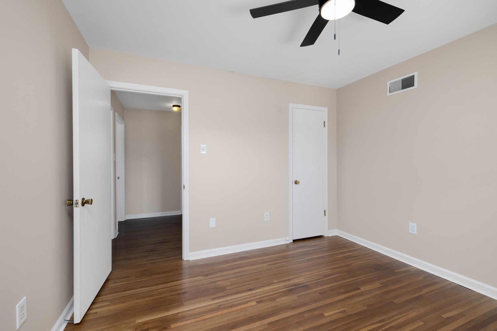 7223 Renda Street Millington, TN 38053 - Photo 17 of 24 a view of an empty room with wooden floor