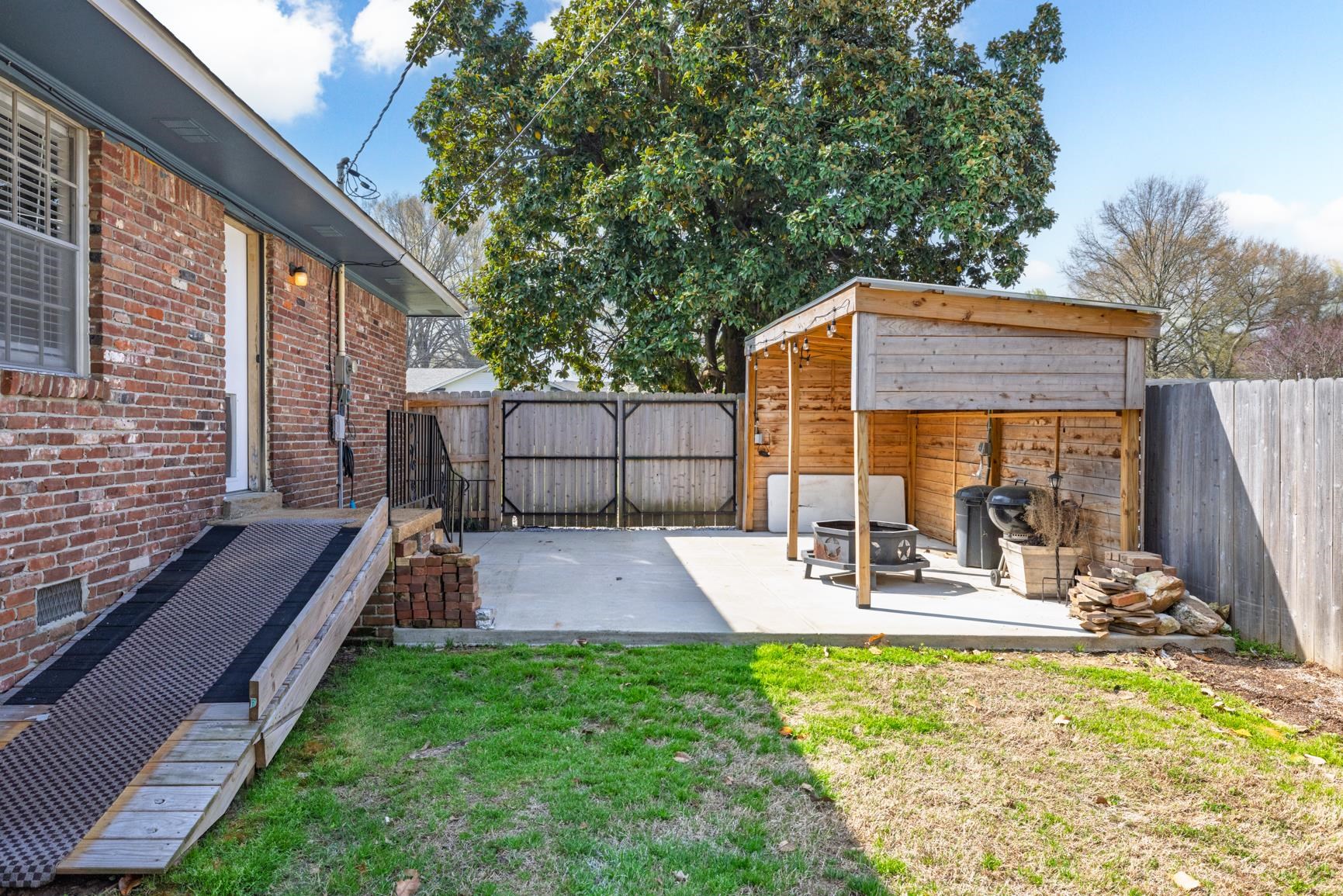 7223 Renda Street Millington, TN 38053 - Photo 24 of 24 a view of outdoor space yard deck patio and outdoor kitchen