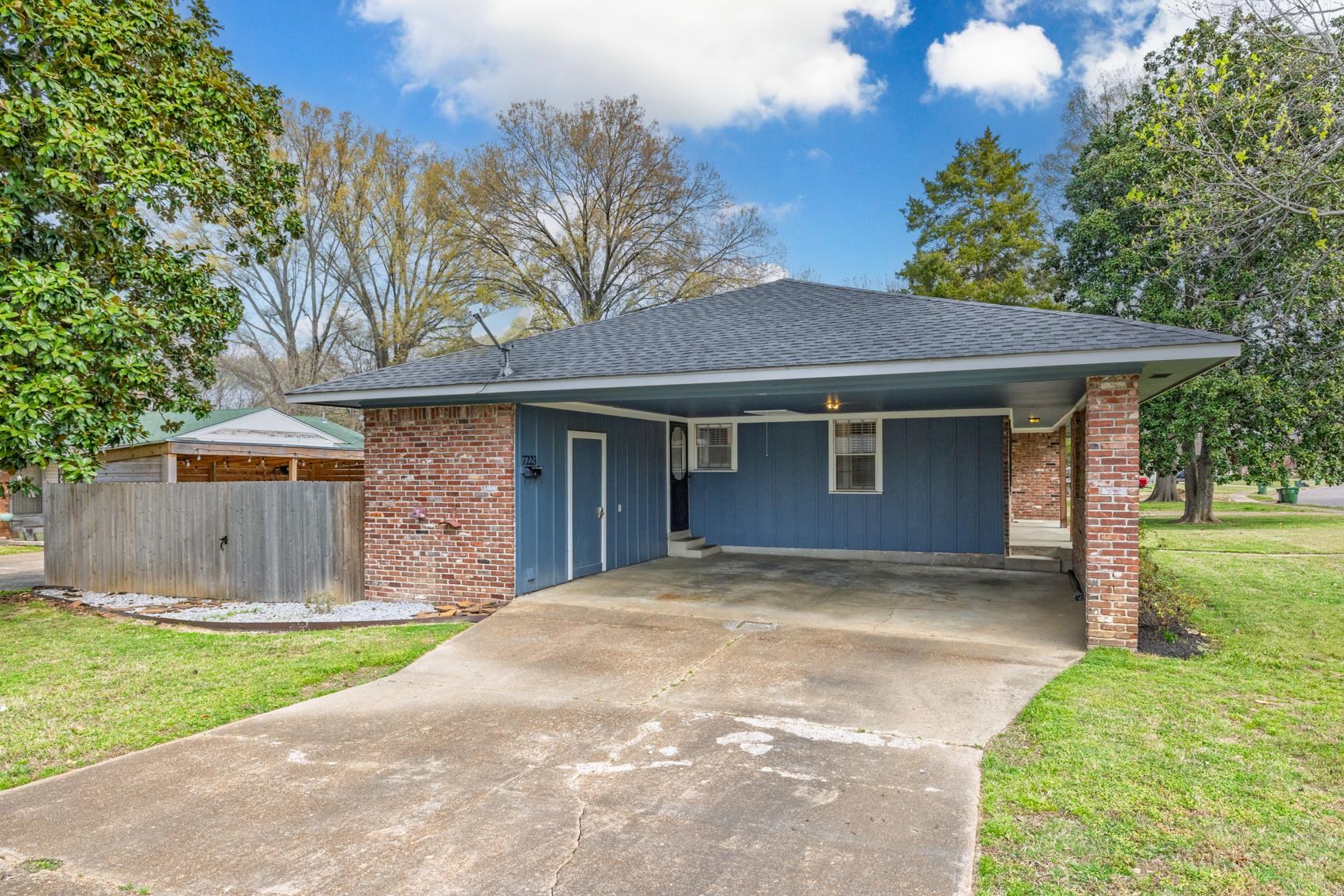 7223 Renda Street Millington, TN 38053 - Photo 3 of 24 a view of a house with a yard and large tree