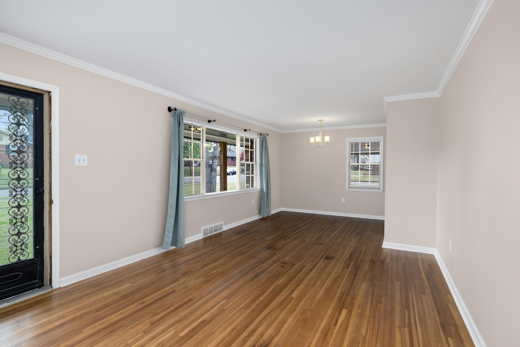 7223 Renda Street Millington, TN 38053 - Photo 6 of 24 an empty room with wooden floor and windows
