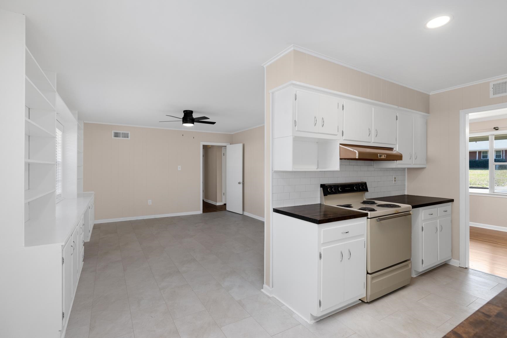 7223 Renda Street Millington, TN 38053 - Photo 8 of 24 a kitchen with stainless steel appliances granite countertop a stove and a refrigerator