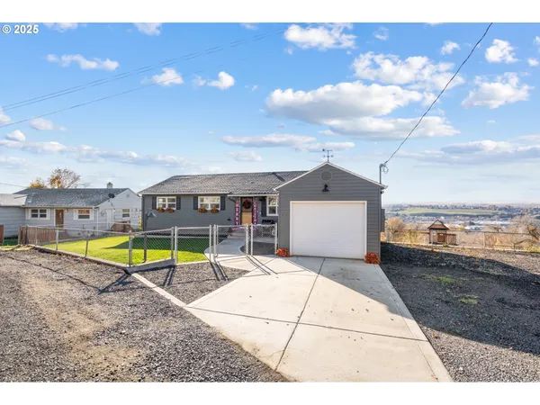 a view of a swimming pool with a lounge chairs