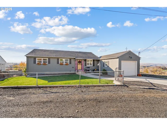 a house with swimming pool and yard