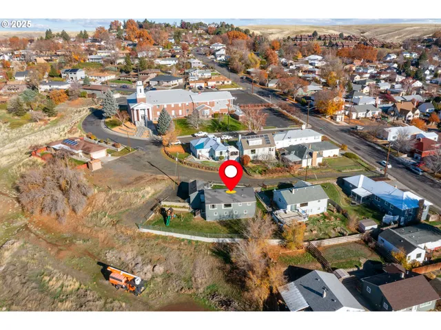 an aerial view of residential houses with outdoor space