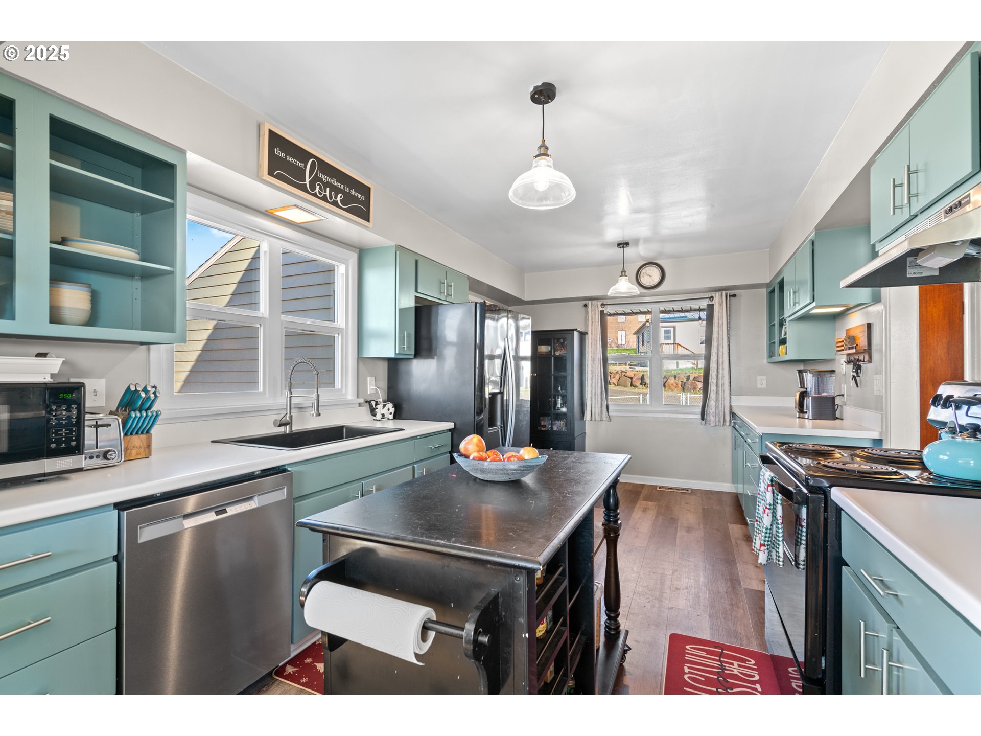 1214 Northwest Furnish Place Pendleton, OR 97801 - Photo 8 of 37 a kitchen with stainless steel appliances granite countertop a stove a sink dishwasher and cabinets with wooden floor