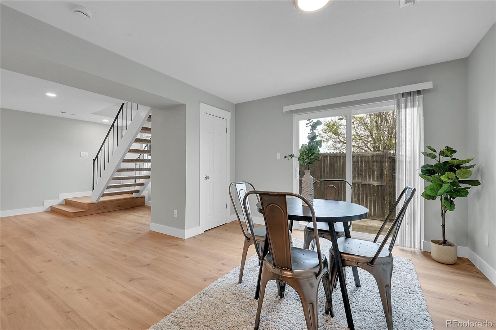 1344 Sable Boulevard Aurora, CO 80011 - Photo 15 of 31 a view of a dining room with furniture and window