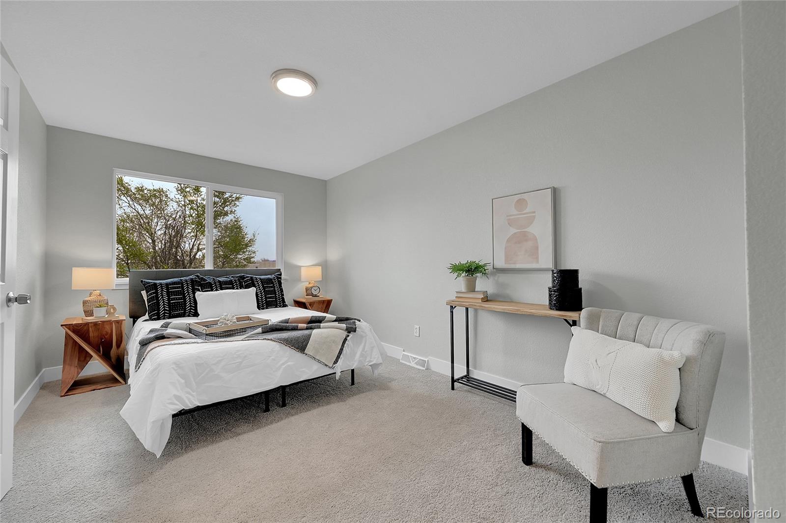 1344 Sable Boulevard Aurora, CO 80011 - Photo 16 of 31 a bedroom with bed and window
