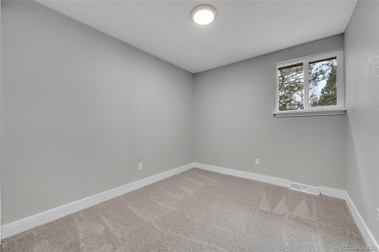1344 Sable Boulevard Aurora, CO 80011 - Photo 19 of 31 an empty room with a window