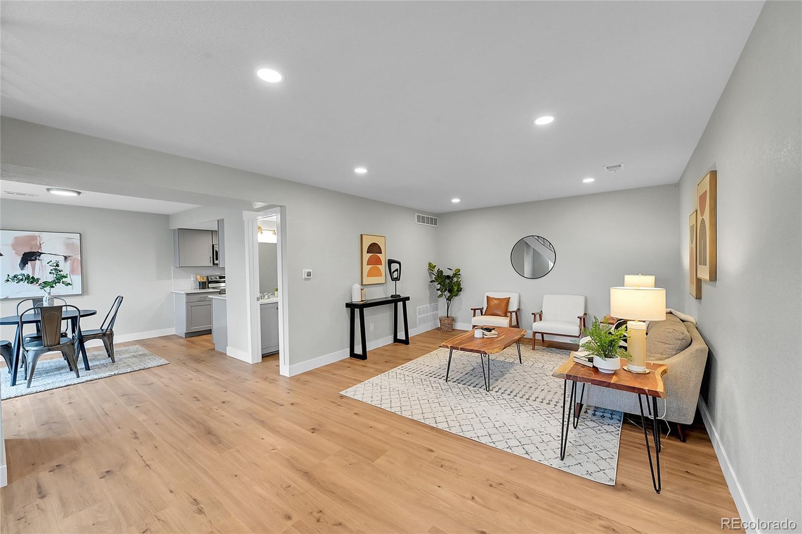 1344 Sable Boulevard Aurora, CO 80011 - Photo 2 of 31 a living room with furniture and a wooden floor