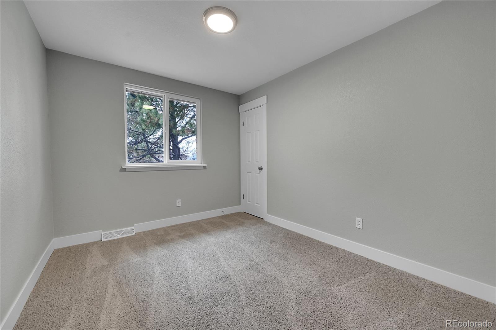 1344 Sable Boulevard Aurora, CO 80011 - Photo 21 of 31 an empty room with windows