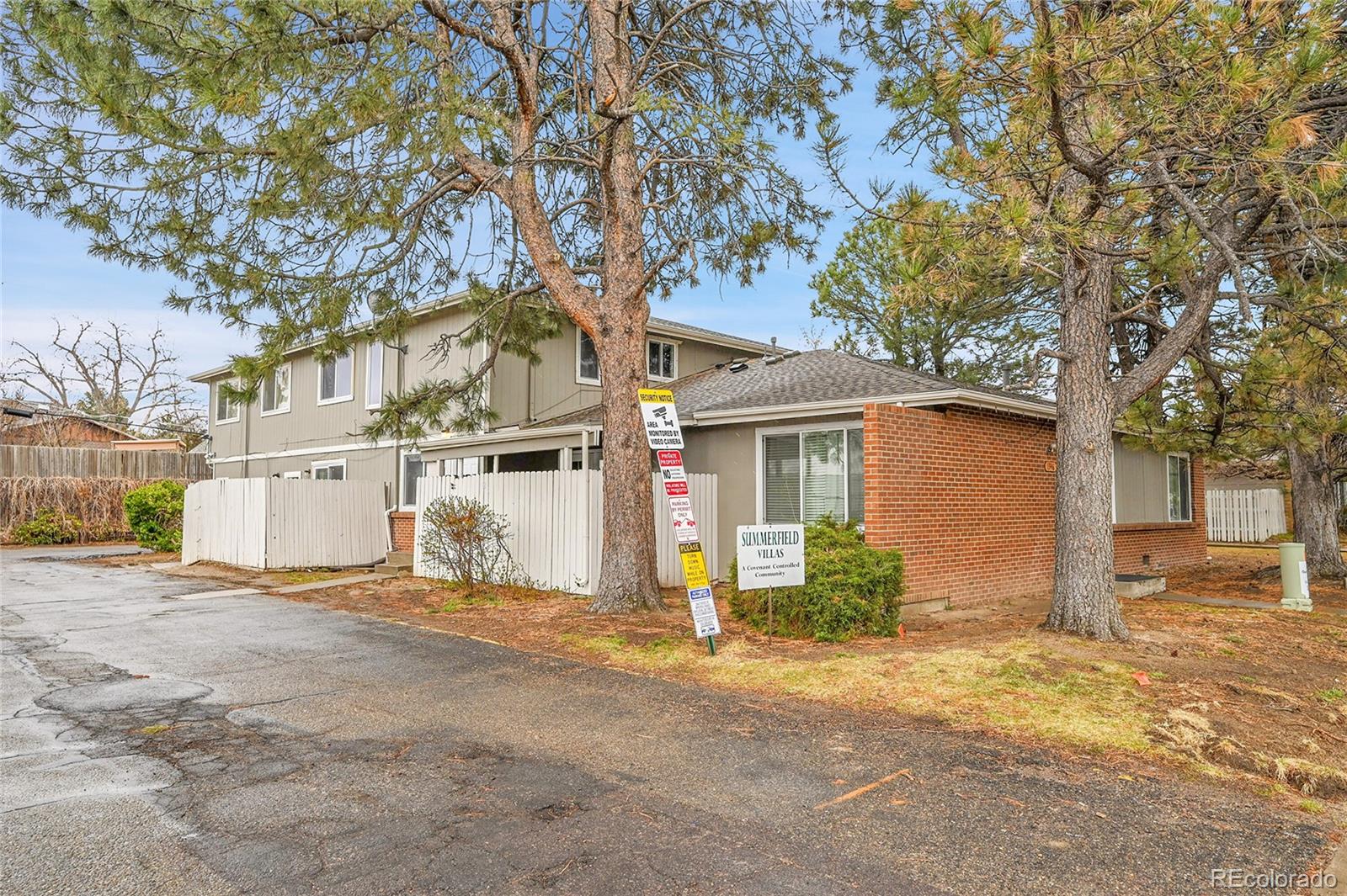 1344 Sable Boulevard Aurora, CO 80011 - Photo 31 of 31 a view of a house with a large tree
