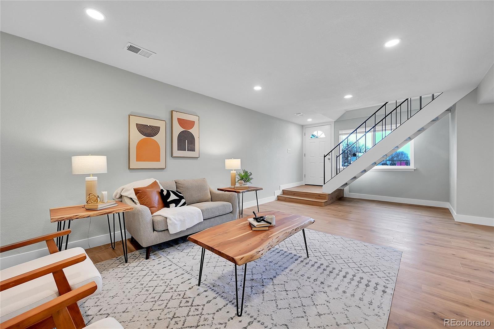 1344 Sable Boulevard Aurora, CO 80011 - Photo 7 of 31 a living room with furniture and wooden floor