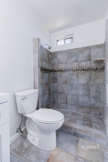 901 West Rader Avenue Ridgecrest, CA 93555 - Photo 15 of 26 a bathroom with a toilet and a shower
