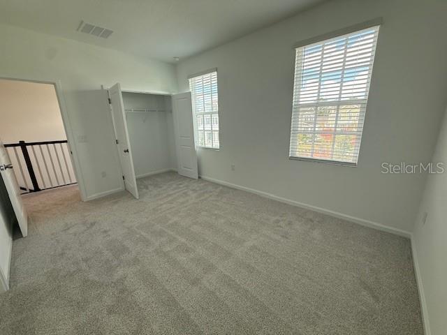 1913 Seawall Way Celebration, FL 34747 - Photo 14 of 34 an empty room with windows