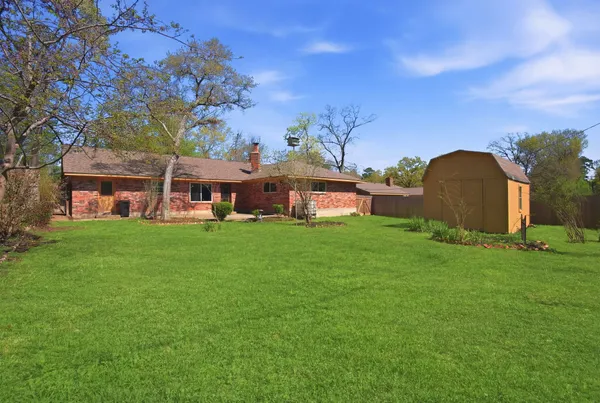 a view of a house with a big yard