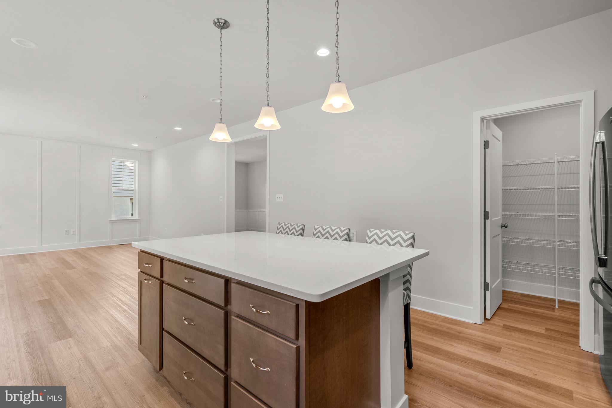 9425 Fairview Avenue Laurel, MD 20723 - Photo 13 of 125 a kitchen with a table and chairs