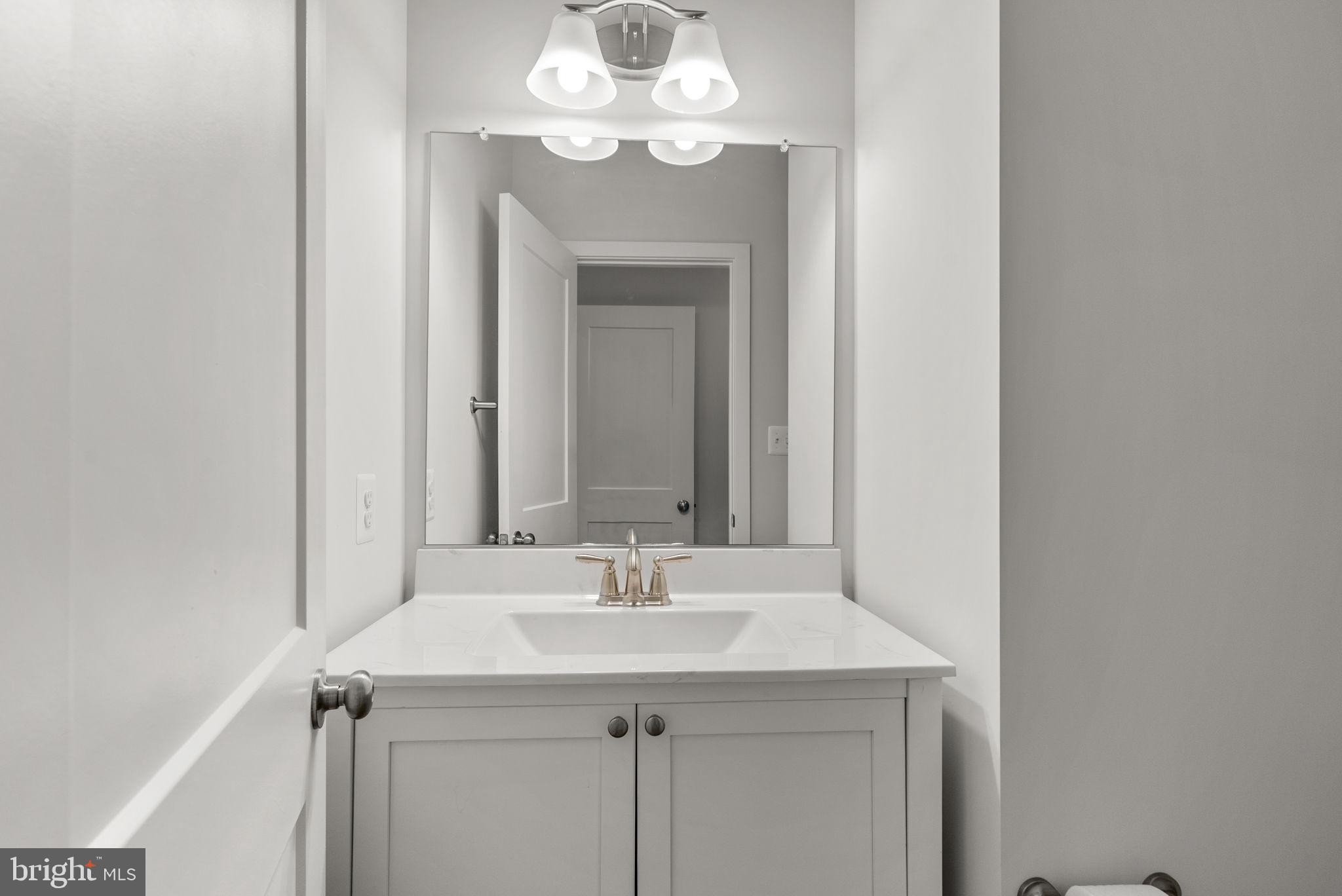 9425 Fairview Avenue Laurel, MD 20723 - Photo 16 of 125 a bathroom with a sink and a mirror