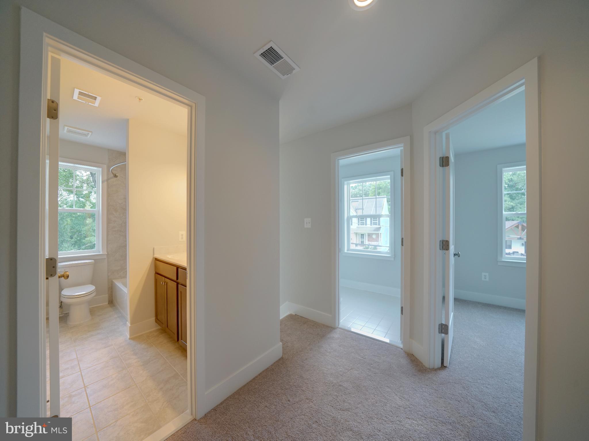 9425 Fairview Avenue Laurel, MD 20723 - Photo 28 of 125 a view of a hallway with toilet and a rooms
