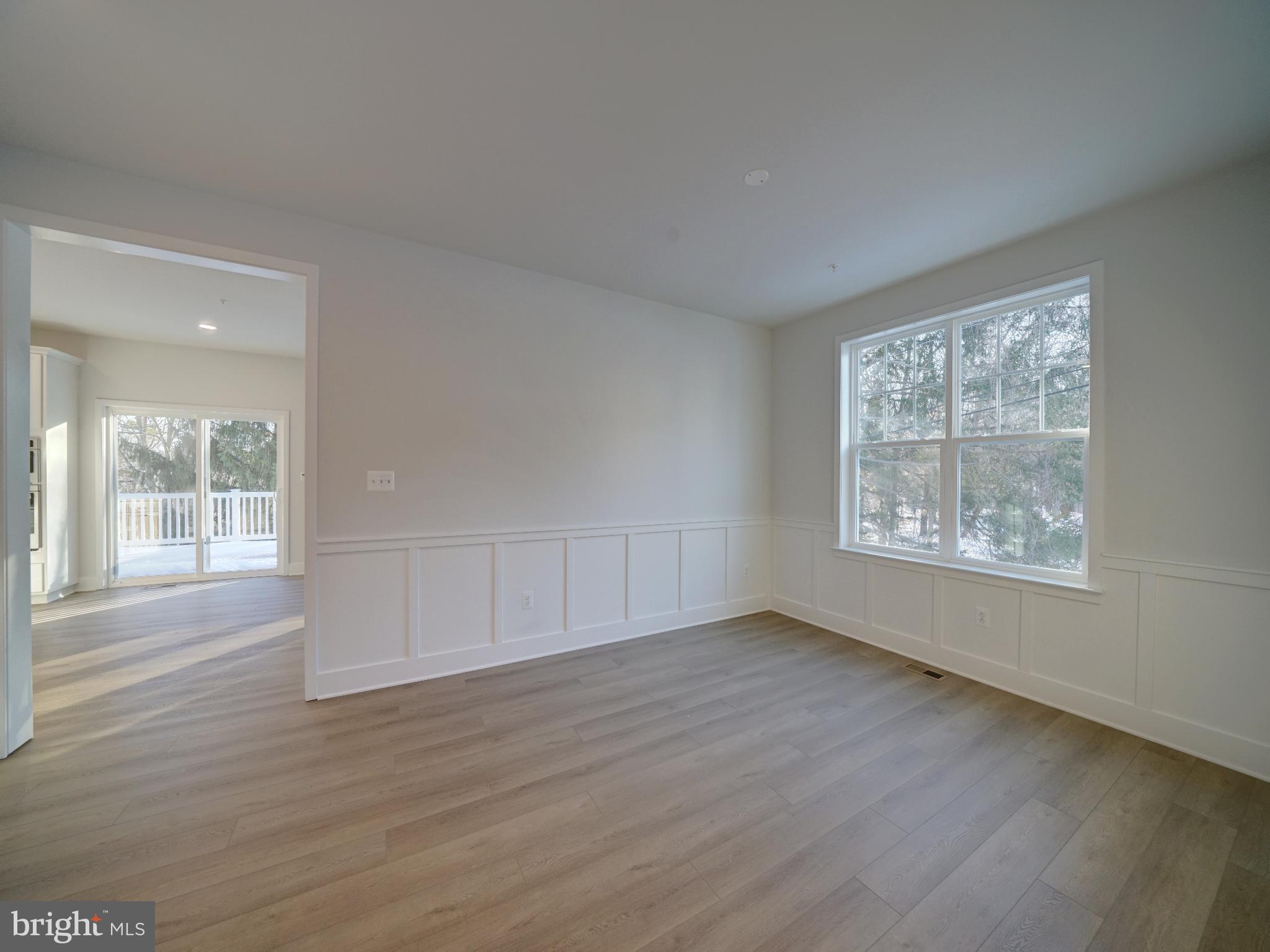 9425 Fairview Avenue Laurel, MD 20723 - Photo 50 of 125 a view of an empty room with wooden floor and a window