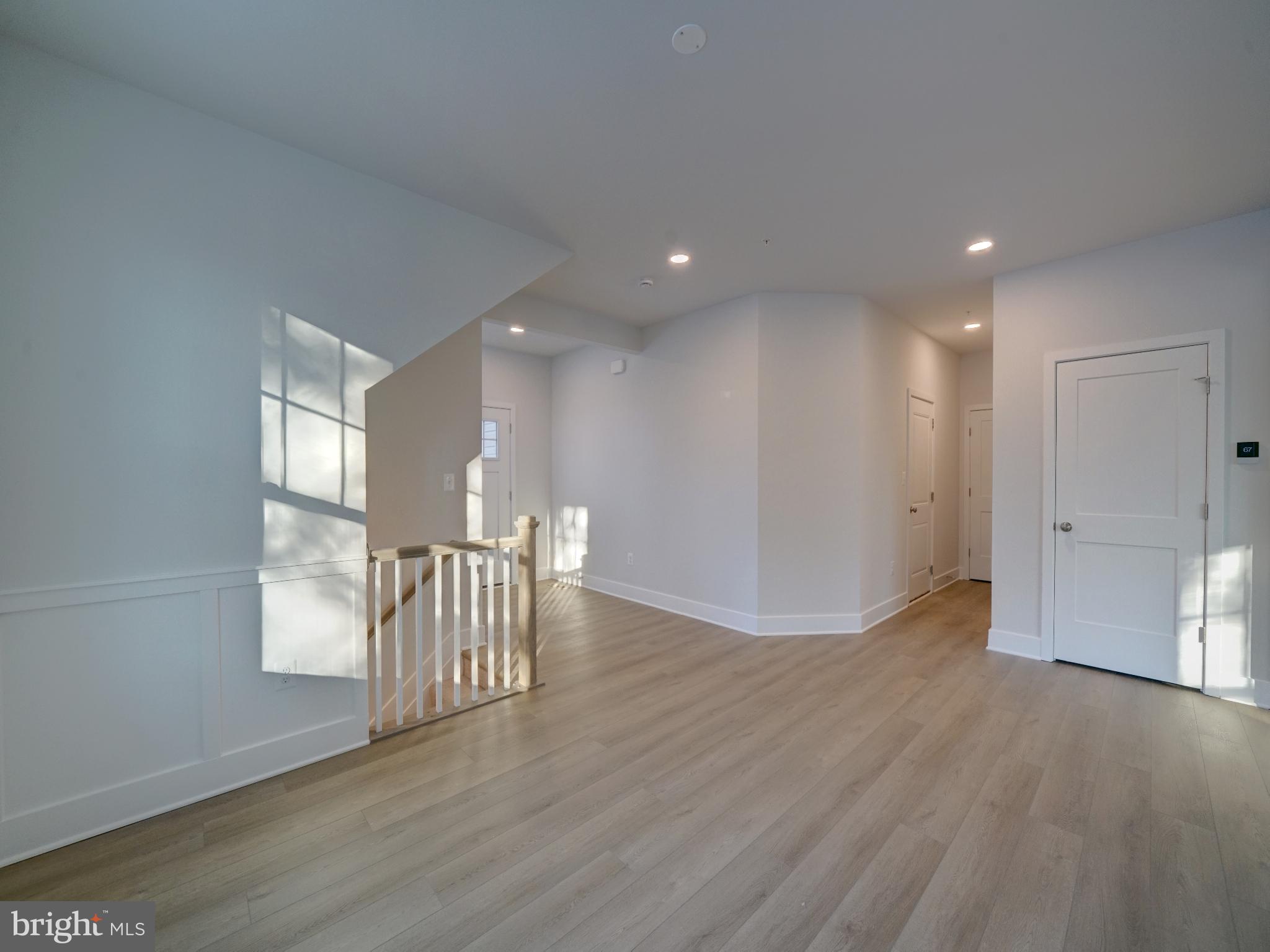 9425 Fairview Avenue Laurel, MD 20723 - Photo 52 of 125 a view of an empty room with wooden floor and a window