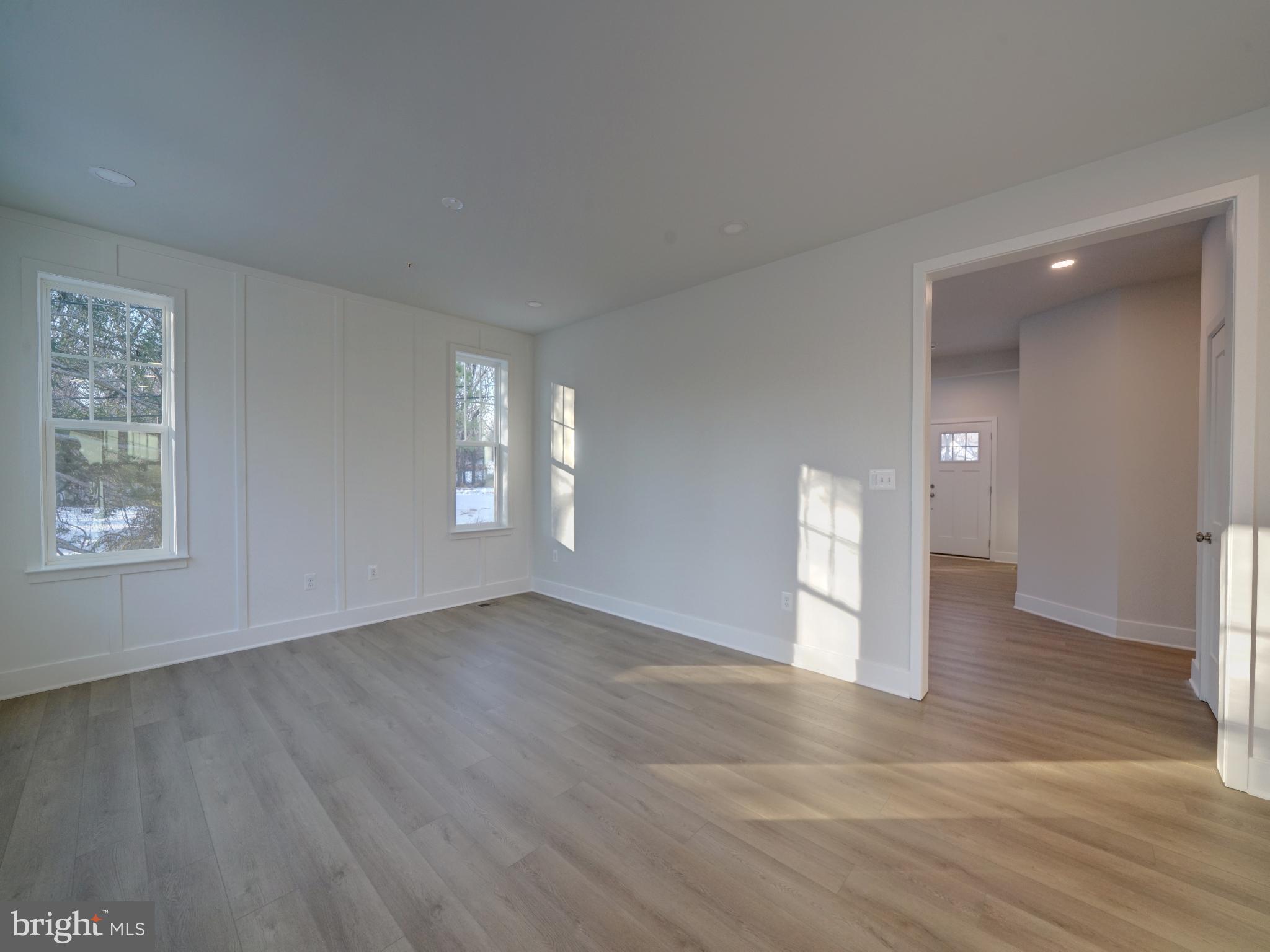 9425 Fairview Avenue Laurel, MD 20723 - Photo 60 of 125 a view of an empty room with window and wooden floor