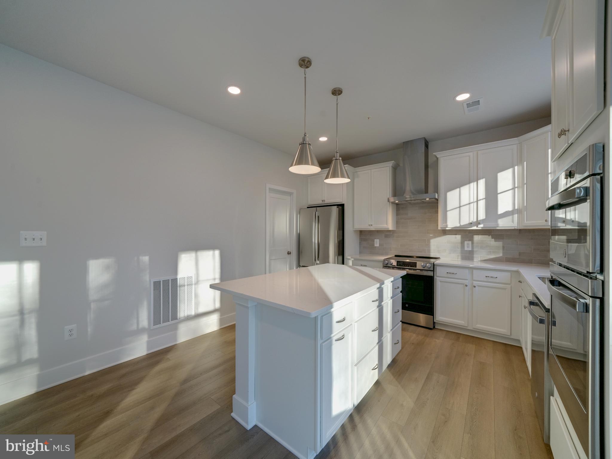 9425 Fairview Avenue Laurel, MD 20723 - Photo 67 of 125 a kitchen with stainless steel appliances a sink stove and refrigerator