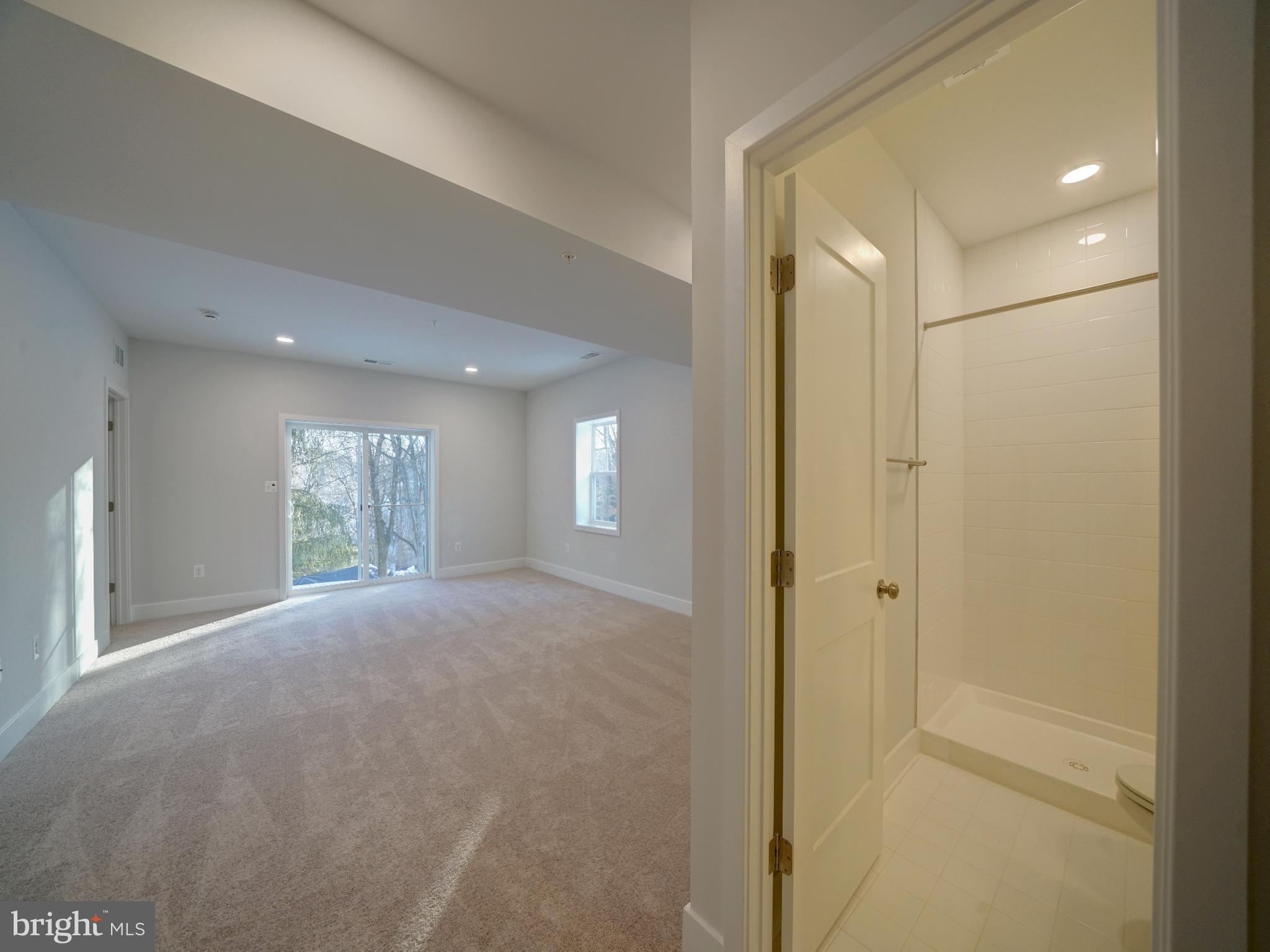 9425 Fairview Avenue Laurel, MD 20723 - Photo 85 of 125 a view of empty room with windows and ceiling fan