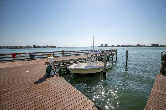 a view of terrace with lawn chairs and iron fence