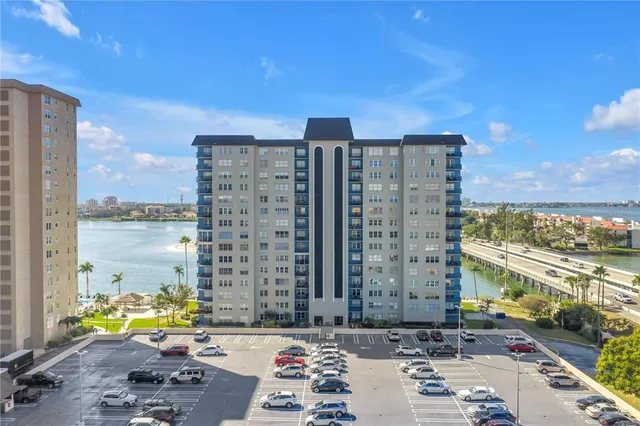 a kitchen with white cabinets and appliances